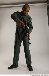 Man Adult Average Black Fighting with gun Standing poses Army